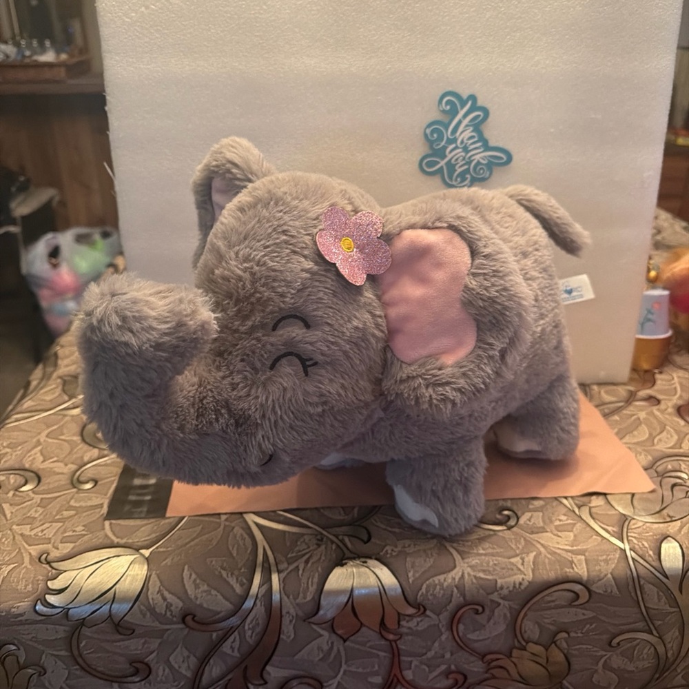 Charming Gray Elephant Plush with Pink Flower